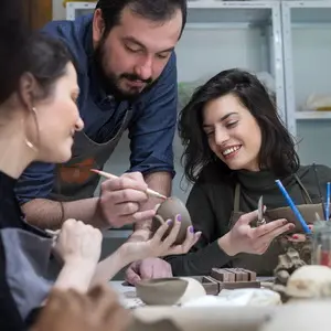 The instructor demonstrates hand-building techniques